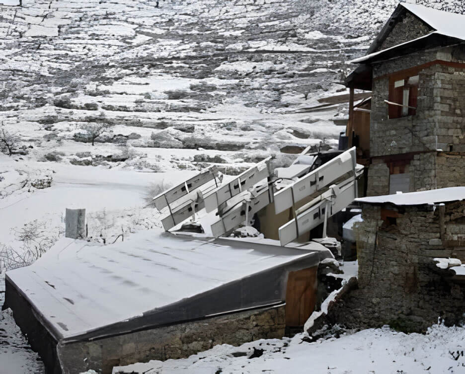 RIDS-Nepal greenhouse in winter with snow outside and spinach growing inside