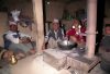 People gathered around their Smokeless Metal Stove