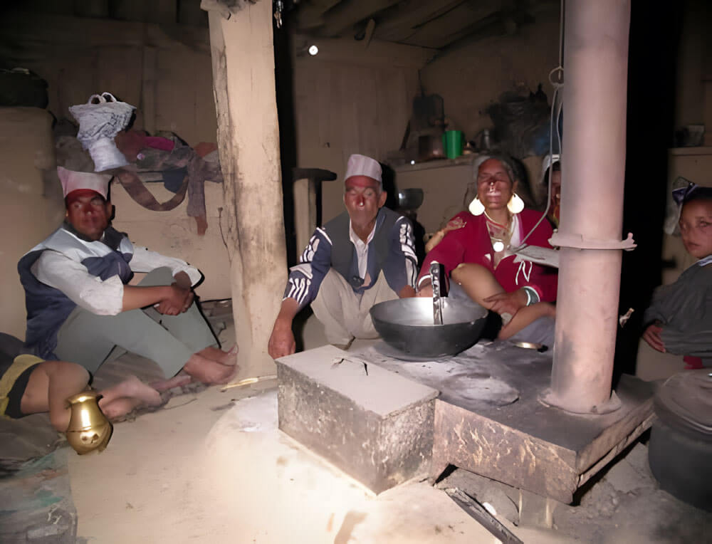 People gathered around their Smokeless Metal Stove