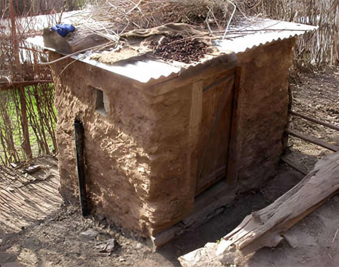 Improved pit latrine with air ventilation pipe at a Nepal school