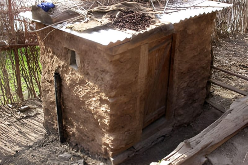 Improved pit latrine with air ventilation pipe at a Nepal school