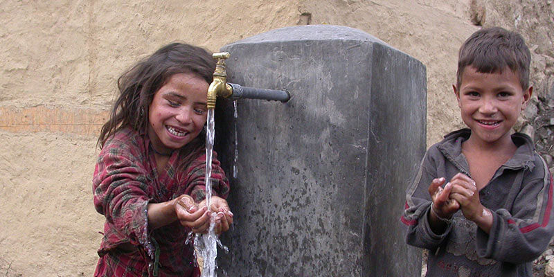 Collecting drinking water from a village spout in Nepal