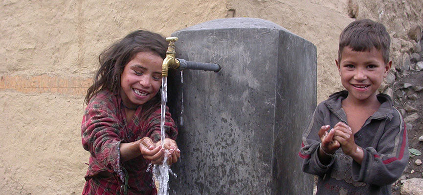 Collecting drinking water from a village spout in Nepal